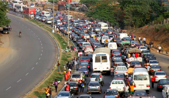 As traffic develops on the Abuja-Keffi Road, thousands of stranded people groan