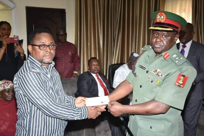 NYSC DG presents insurance cheques to family of late Corps member